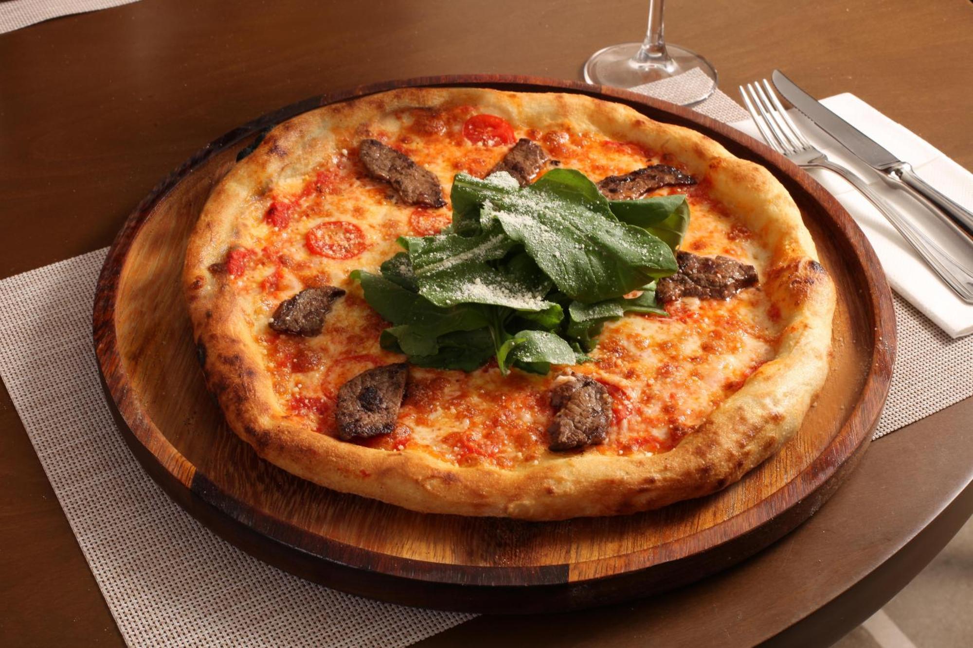 Bentley Hotel Bosphorus - Special Class Istanbul Exterior photo A pizza with sausage and arugula